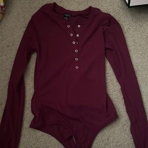 size medium rue 21 burgundy body suit